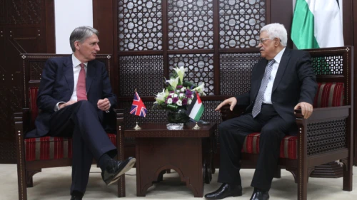 Palestinian Authority leader Mahmoud Abbas (right) meets with British Foreign Secretary Philip Hammond in the West Bank city of Ramallah on July 23, 2014. Photo by Issam Rimawi/Flash90.