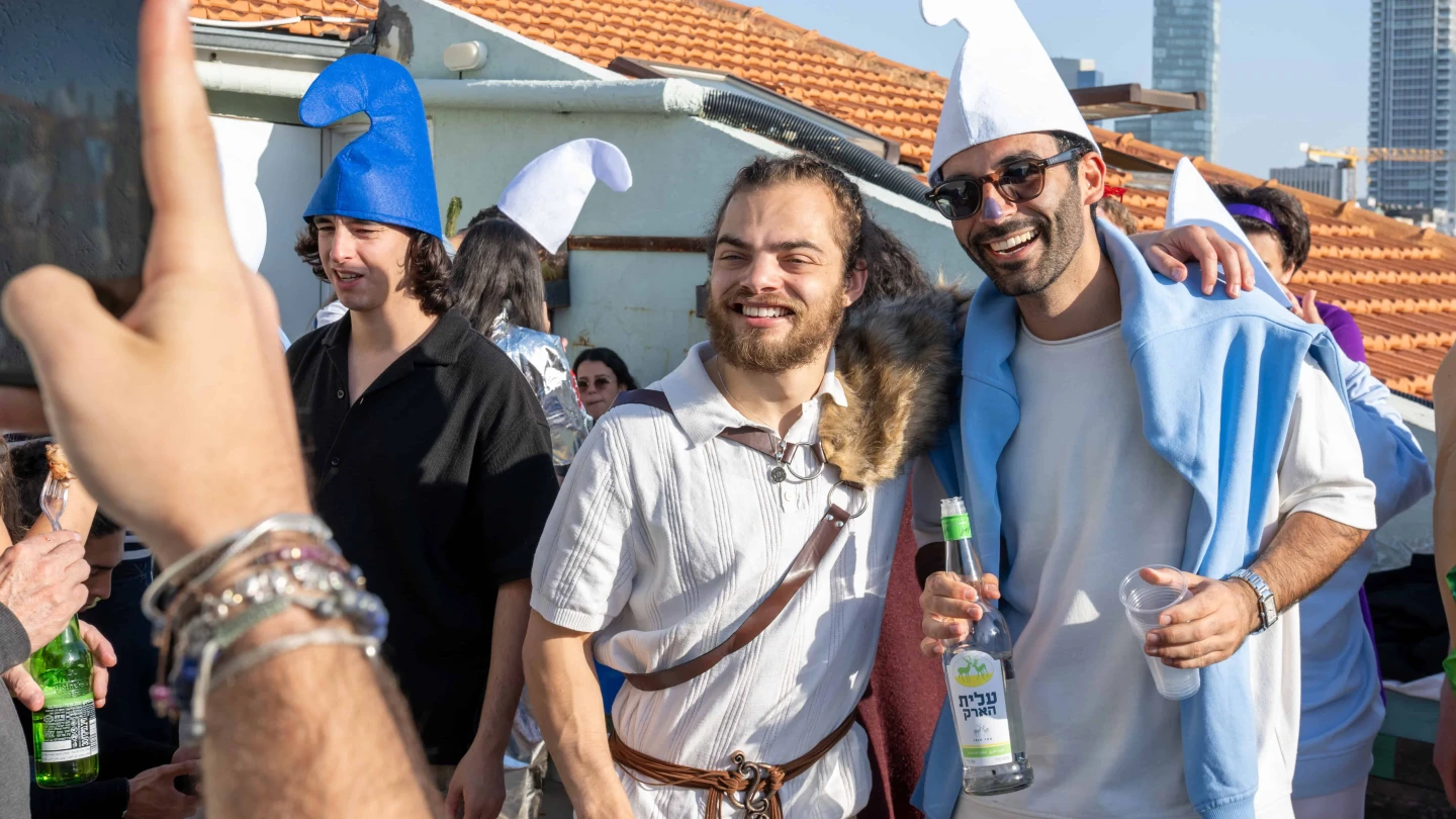 People dressed in costume pose for photos