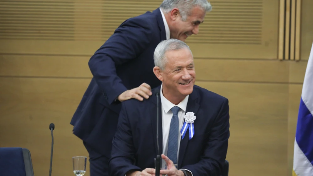 Blue and White Party leaders Benny Gantz (seated) and Yair Lapid at a faction meeting at the opening of the 22nd Knesset in Jerusalem, on Oct. 3, 2019. Photo by Hadas Parush/Flash90.