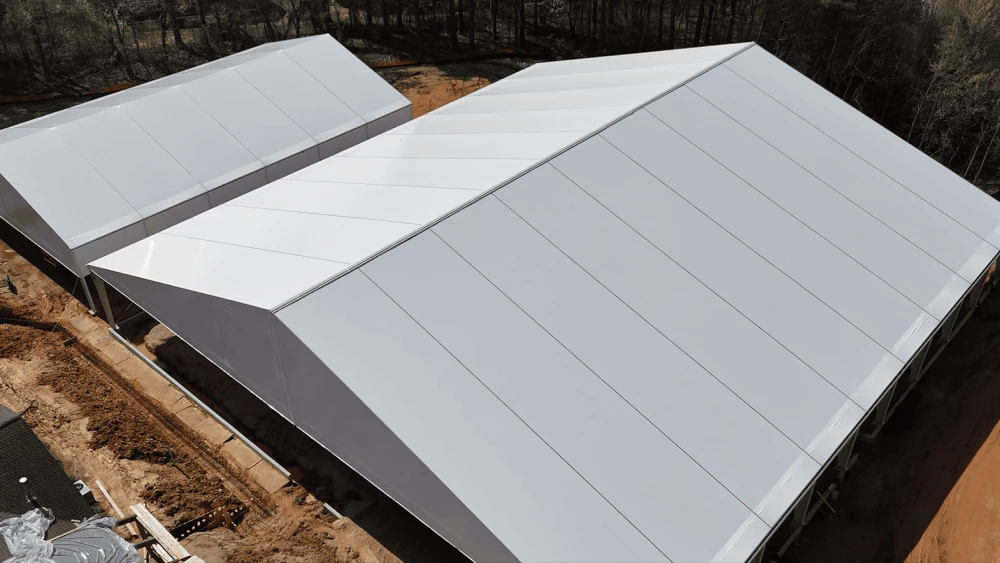 Construction of the Eva G.Lipman Pickleball Complex, featuring eight covered pickleball courts with rain-protection siding allowing for all-weather play; to the left, the Zaban Family Sports Pavilion, a large covered multi-sport court with high-efficiency fans. Credit: Courtesy of MJCCA.