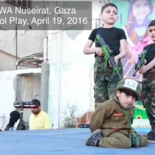 A school play performed at the UNRWA Nuseirat School in Gaza, in which students hold an Israeli hostage at gunpoint, April 2016. Credit: Center for Near East Policy Research.