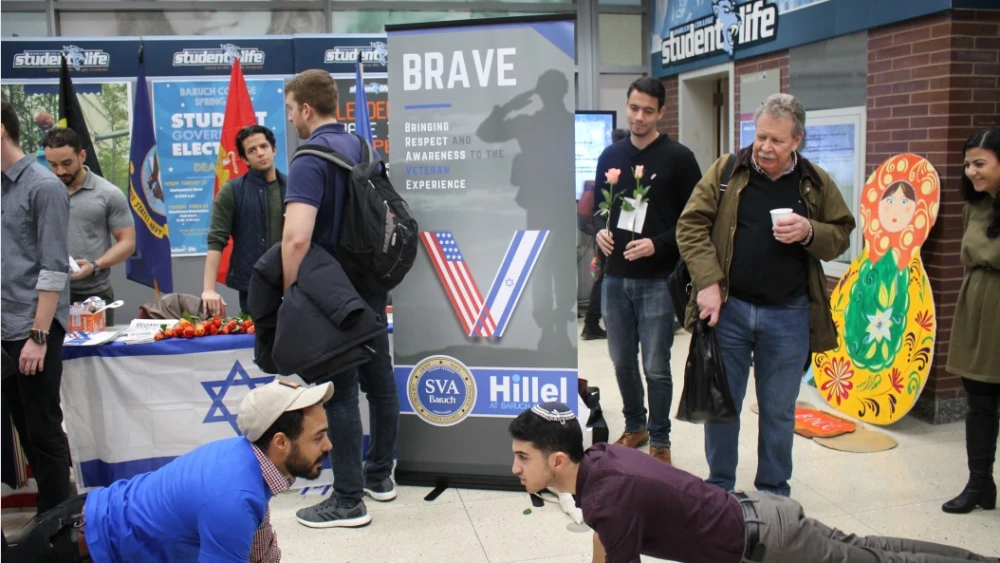 “Brave” supporters engaging in a push-up contest near a tabling event for the program. Credit: Courtesy.
