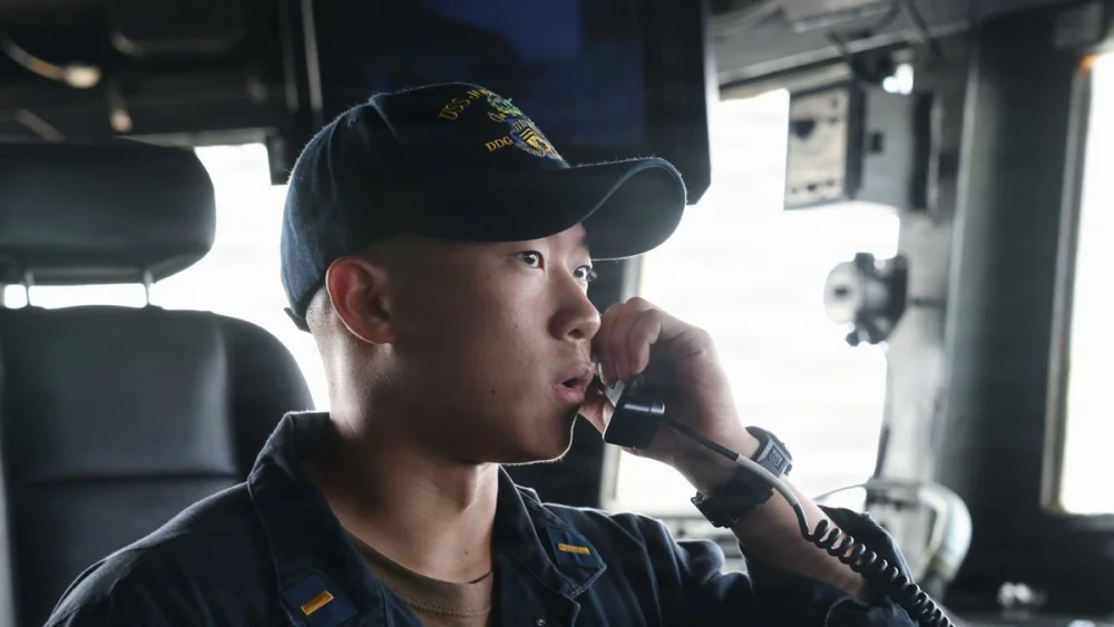 A U.S. Navy sailor aboard guided-missile destroyer USS John Finn (DDG 113), as American forces continue implementing the naval blockade against Iran. Credit: U.S. Central Command.