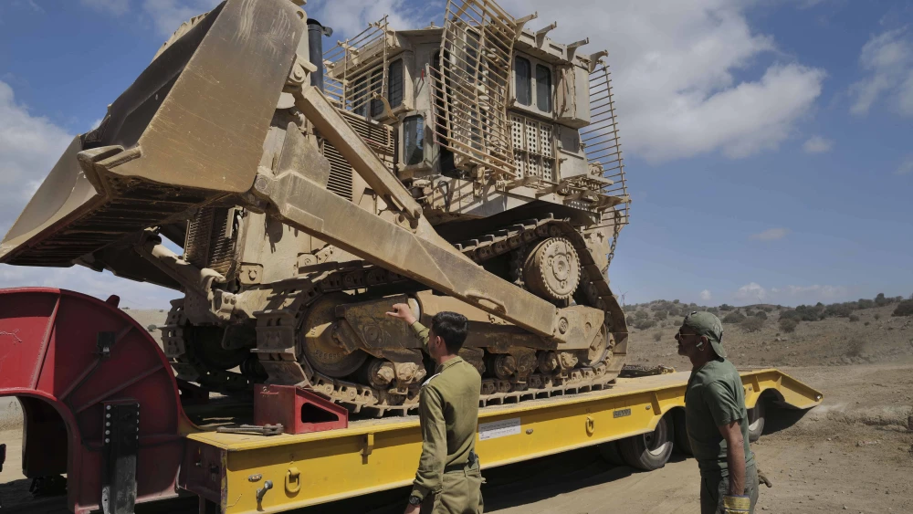 IDF Engineering Corps troops moving an IDF Caterpillar D-9 armored bulldozer, in the northern Golan Heights, on Sept. 19, 2024. Photo by Michael Giladi/Flash90.