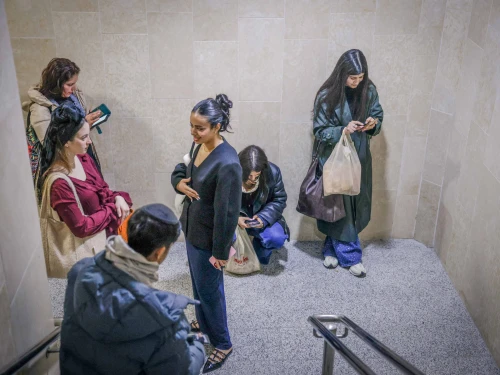 Israelis take cover at Yitzhak Navon train station in Jerusalem as a siren sounds warning of incoming ballistic missiles fired from Iran toward Israel, March 1, 2026. Photo by Rachel Alroey/Flash90.