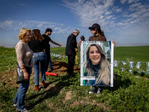 Friends and family of Liraz Assulin, who was murdered by Hamas terrorists in the Oct. 7 massacre, plant a tree in her memory at the place where she was murdered near the Israeli border with the Gaza Strip, southern Israel Jan. 21, 2024. Photo by Chaim Goldberg/Flash90.
