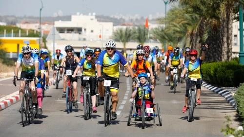 Adults and kids participate in the “Wheels of Love” annual bike race in Israel. Credit: Tomer Feder Sport Photography.