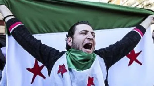 Anti-Syrian regime protester chants slogans against Syrian President Bashar Assad. Credit: Freedom House via Flickr.