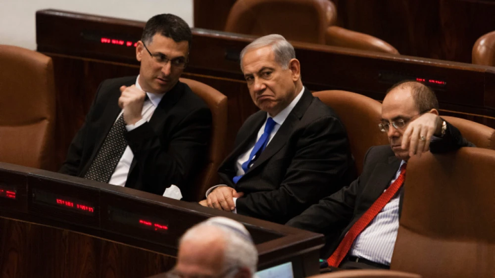 From left, Interior Minister Gideon Sa'ar, Prime Minister Benjamin Netanyahu and Regional Development Minister Silvan Shalom attend a special Knesset session in Jerusalem on July 9, 2013. Credit: Flash90.