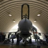 Israeli soldiers prepare an F-16 jet