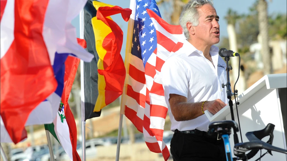 Canadian Jewish-Israeli philanthropist Sylvan Adams speaks at a cycling event in Israel. Credit: Israel Cycling Academy.