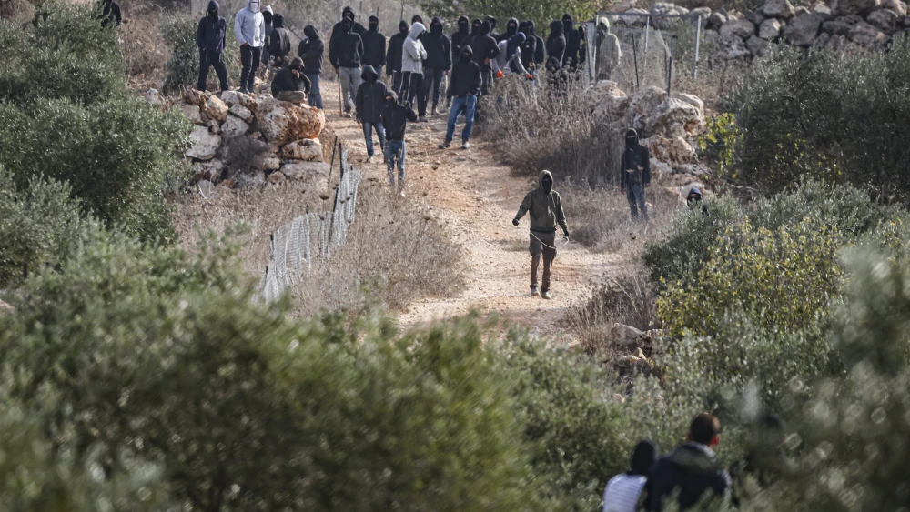 Israelis and Palestinians clash during the annual olive harvest in the village of Khirbet Abu Falah, north of Ramallah, where several people, including American photojournalist Heidi Levine, were injured on Oct. 16, 2026. Photo by Flash90.