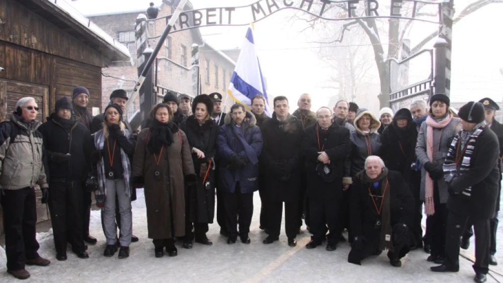 Israel Parliament members pose for a group picture at the entrance to the Auschwitz concentration camp in Poland on International Holocaust Remembrance Day, Jan. 27, 2010. Photo by Isaac Harari/Flash90.