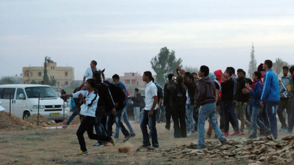 Click photo to download. Caption: On Nov. 30, 2013 in the southern Israeli town of Hura, demonstrators protest the Israeli government's "Prawer Plan" to resettle Bedouin residents of the Negev desert. The fate of the plan, which continued to be discussed by Israeli Knesset members after its apparent cancelation Dec. 12, remains a mystery. Credit: Flash90.