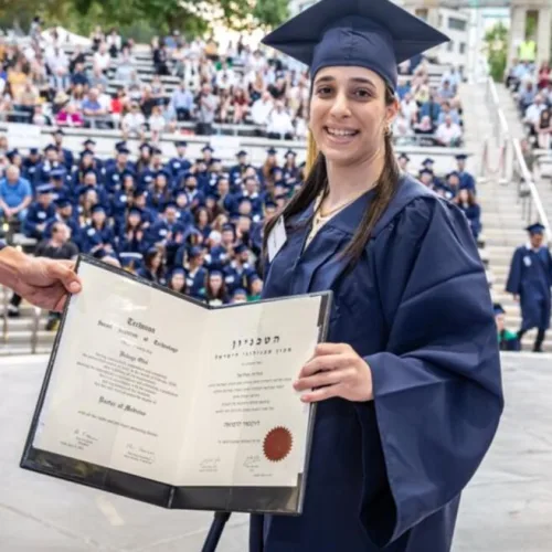 Hodaya Oliel at her graduation from the Technion’s medical school. Born with cerebral palsy, she plans to specialize in pediatric neurology. Photo courtesy of Technion-Israel Institute of Technology.