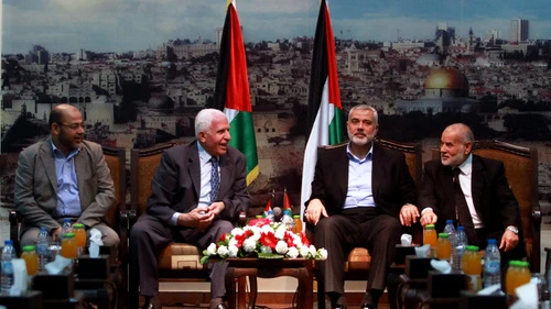From left: Senior Hamas leader Moussa Abu Marzouk, senior Fatah official Azzam al-Ahmed, head of the Hamas government Ismail Haniyeh and deputy speaker of the Gaza-based Palestinian Parliament Ahmed Bahar attend a meting in Gaza City on April 22, 2014. Credit: Abed Rahim Khatib/Flash90.