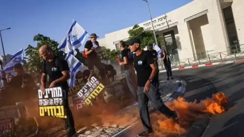 Activists protest against the government's planned judicial overhaul, outside Har Hamor Yeshiva in Har Homa, Jerusalem, on July 5, 2023. Photo by Chaim Goldberg/Flash90.