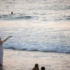 A woman performs "tashlich," a Jewish ritual performed before the eve of Rosh Hashanah, at the beach in Tel Aviv, on Sept. 10, 2018. Photo by Yonatan Sindel/Flash90.