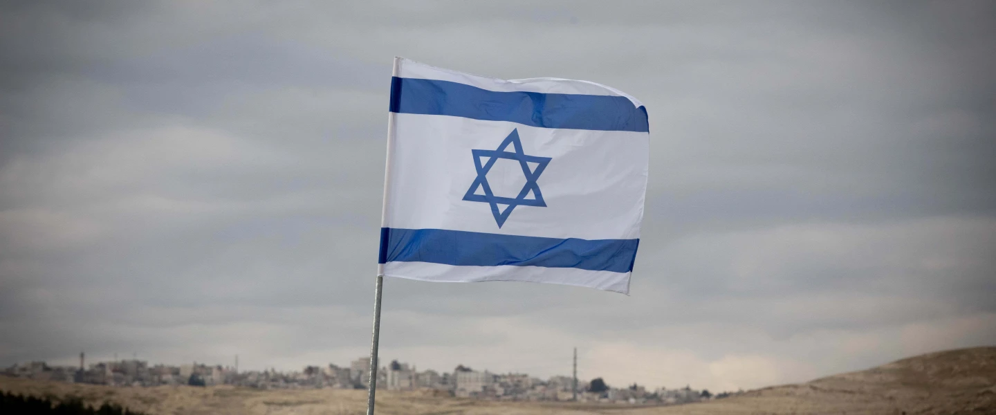 An Israeli flag in the E1 area of Ma'ale Adummim in Judea, Jan. 2, 2017. Photo by Yonatan Sindel/Flash90.
