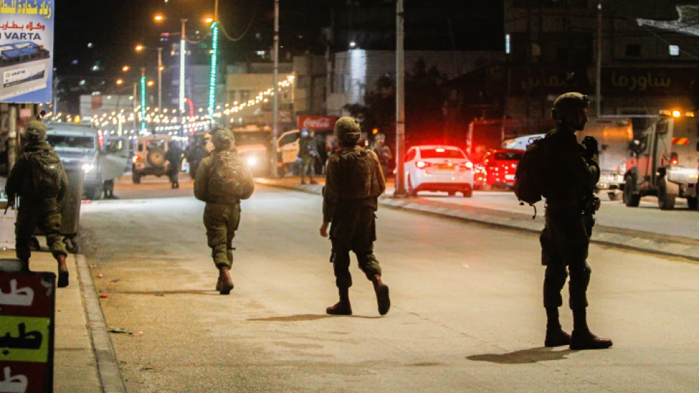 Israeli security forces secure the scene of a shooting attack in Huwara, in Samaria, near Nablus, March 25, 2023. Photo by Nasser Ishtayeh/Flash90.