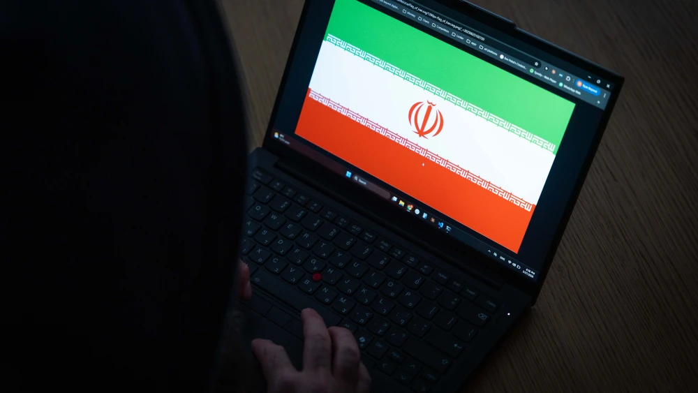 An illustrative photo of a laptop displaying the Iranian flag, representing Iran in a digital or cyber context, March 27, 2026. Photo by Nati Shohat/Flash90.