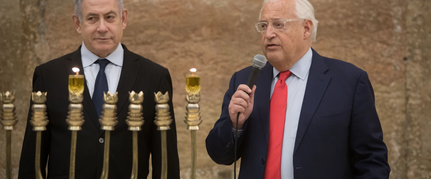 Israeli Prime Minister Benjamin Netanyahu and U.S. Ambassador to Israel David Friedman light Hanukkah candles at the Western Wall on December 22, 2019. Photo by Noam Revkin Fenton/Flash90.