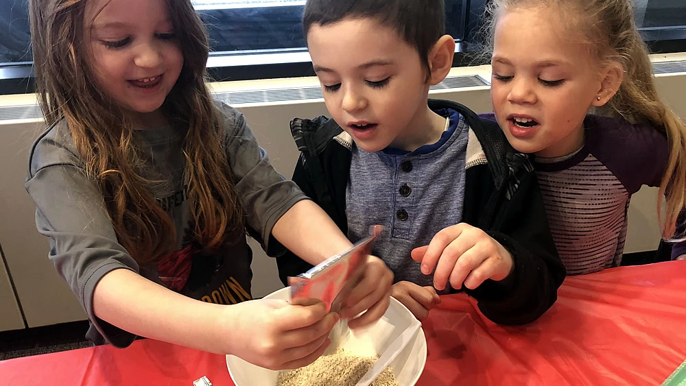 Kids cook at the Jewish Camp Gan Israel adventure in Anchorage, Alaska. Credit: Gan Izzy Alaska In-Service Day Winter Camps 2019.