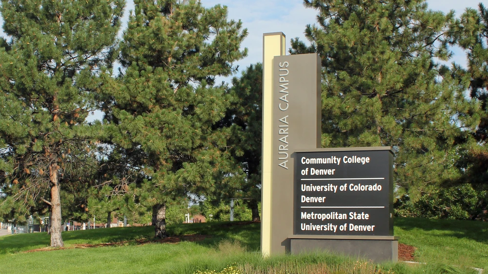 A sign for the Auraria Campus located at the intersection of Kalamath Street and West Colfax Avenue, in Denver. Credit: Jeffrey Beall via Wikimedia Commons.