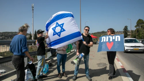 Anti-vaccine activists protest, calling the government to cancel the COVID-19 emergency restrictions, at Hemed Junction, near Jerusalem, on Feb. 18, 2022. Photo by Yossi Aloni/Flash90.