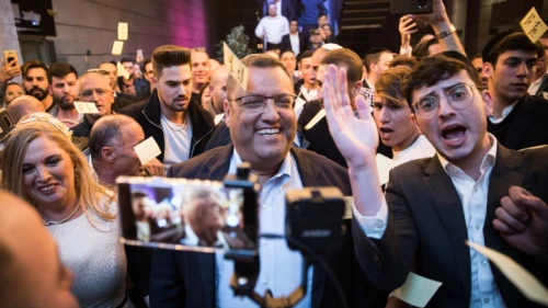 Supporters celebrate as Jerusalem mayoral candidate Moshe Lion arrives at his campaign headquarters as he leads the early counting in the municipal elections for Jerusalem on Oct. 30, 2018.