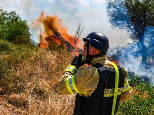 A Firefighter at a wildfire following a missile attack from Lebanon, near Kibbutz Snir in the Galilee panhandle, Sept. 16, 2024. Photo by Ayal Margolin/Flash90.