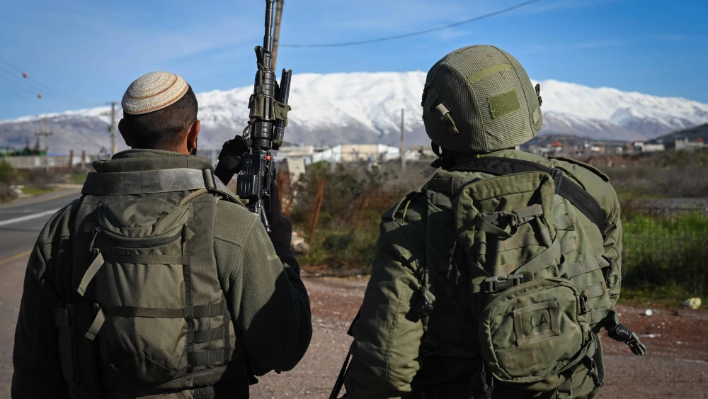Israeli soldiers in the Golan Heights, northern Israel, with Mount Hermon in the background, Feb. 8, 2024. Photo by Michael Giladi/Flash90.