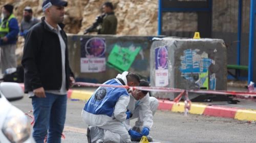 Israeli soldiers and police inspect the scene of a shooting attack at the entrance to the Israeli settlement of Givat Asaf, in the West Bank, on Dec. 13, 2018. Photo by Hadas Parush/Flash90.