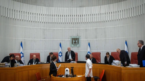 Acting President of the Israeli Supreme Court Uzi Vogelman and fellow justices arrive at a hearing in Jerusalem on June 18, 2023. Credit: Yonatan Sindel/Flash90.
