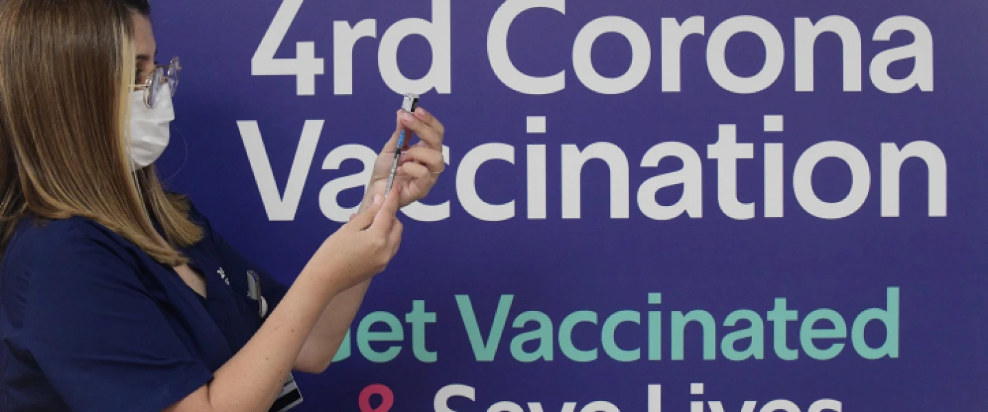A health worker prepares a fourth dose of Pfizer COVID-19 vaccine at the Sheba Medical Center. on Dec. 31, 2021. Photo by Tomer Neuberg/Flash90.