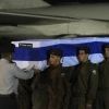 Israeli soldiers carry the five coffins holding Israeli citizens Itzik Colangi, 28, Amir Menashe, 28, Maor Harosh, 25, Elior Price, 26, and Kochava Shriki, 44, killed in a suicide bombing attack in Bulgaria July 18, at a cermony after the bodies arrived at Ben-Gurion Airport early Friday morning, July 20. Credit: Amos Ben Gershom/GPO/FLASH90.