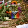 A pride flag and flowers at a makeshift memorial near the scene where a white van that suspect Abdul B. used in an attack against participants of the Christopher Street Day Berlin Pride Parade in Berlin, July 26, 2026. Photo by Omer Messinger/Getty Images.