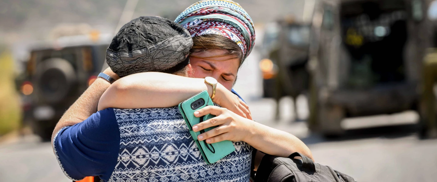 Women at the scene of a terrorist attack near Danny Spring, or Ein Bubin, in the Binyamin region of Samaria on Aug. 23, 2019. A father and his two children were seriously wounded when a grenade or improvised explosive device was thrown at them. Credit: Flash90.