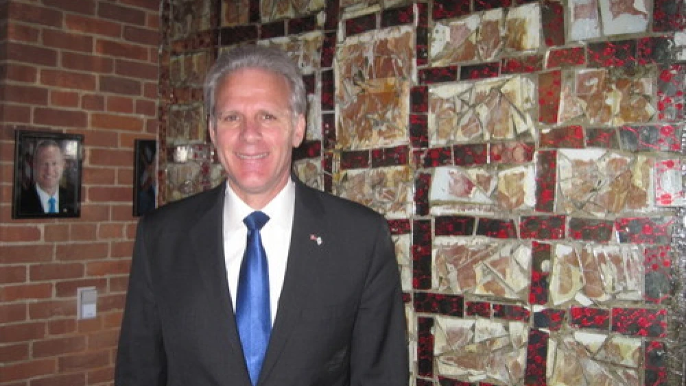 Ambassdor Michael Oren in front of artwork titled "Shalom" at the Banneker Douglass Museum of African American history in Annapolis, Md., with a photo of Maryland Gov. Martin O'Malley in the background. Credit: Paul Foer.