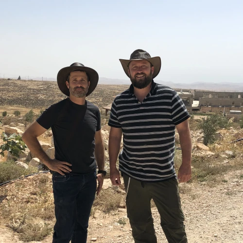 Jeremy Gimpel (left) and Ari Abramowitz on their property, Arugot Farms, in the Judean Desert. Photo by Josh Hasten.