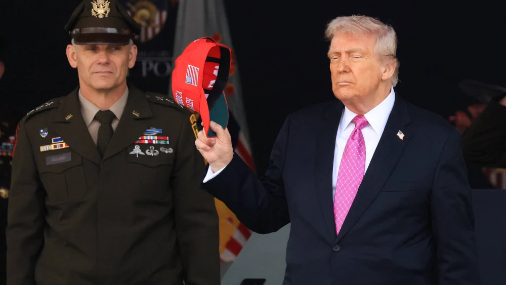 U.S. President Donald Trump removes his hat as he departs after delivering the commencement address at the 2025 U.S. Military Academy Graduation Ceremony at West Point, N.Y., on May 24, 2025. Photo by Charly Triballeau/AFP via Getty Images.