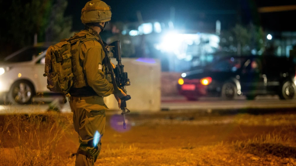 An Israeli soldiers near the scene of a suspected terror attack at the entrance to the village of Husan, west of Bethlehem, on June 23, 2018. Photo by Aharon Krohn/Flash90.