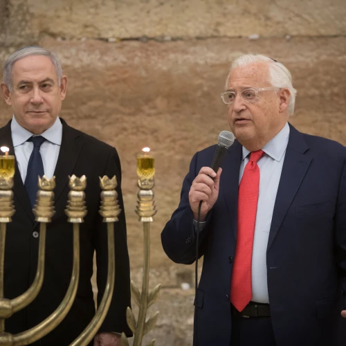 Israeli Prime Minister Benjamin Netanyahu and U.S. Ambassador to Israel David Friedman light Hanukkah candles at the Western Wall on December 22, 2019. Photo by Noam Revkin Fenton/Flash90.
