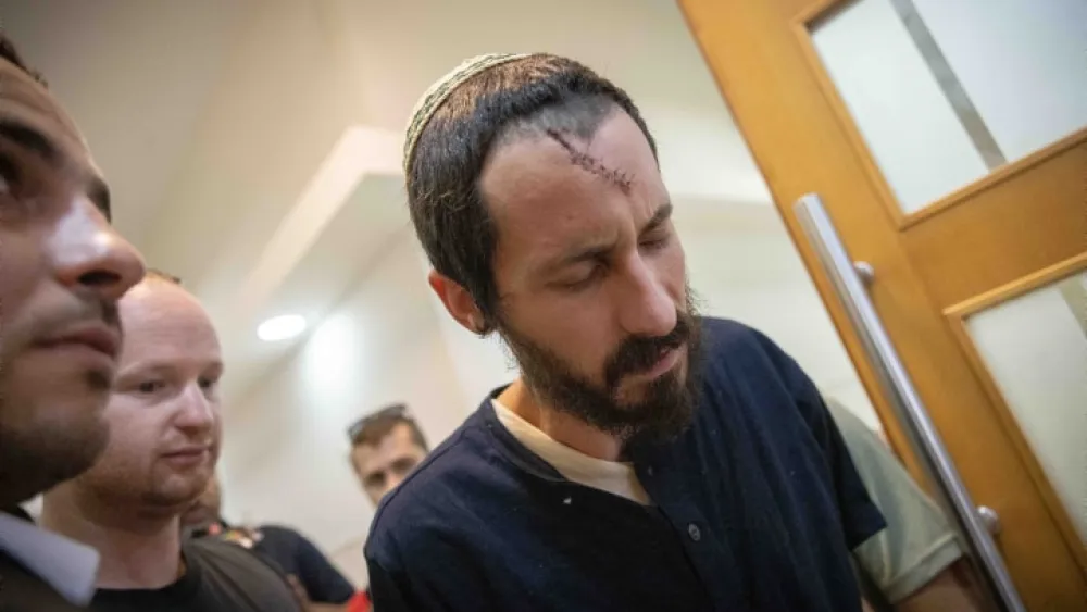 Yehiel Indore, who is suspected of shooting and killing 19-year-old Palestinian Qusai Jamal Maatan in the West Bank village of Burqa, arrives for a court hearing at the District Court in Jerusalem, on Aug. 14, 2023. Photo by Chaim Goldberg/Flash90.