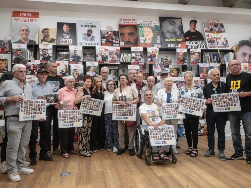 Holocaust survivors pose for a photograph after meeting released hostages families of hostages still being held in Gaza, in Tel Aviv on August 5, 2025. Photo by Chen Schimmel.