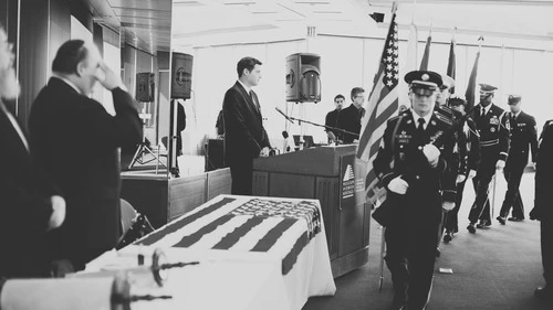 Click photo to download. Caption: The color guard marches during an Oct. 12 dedication of a Torah scroll for the U.S. military at the Museum of Jewish Heritage in Manhattan. At the podium is Jacob Kamaras, and at left giving a salute is his father, Philip Kamaras. Credit: Alexa Drew Photography.