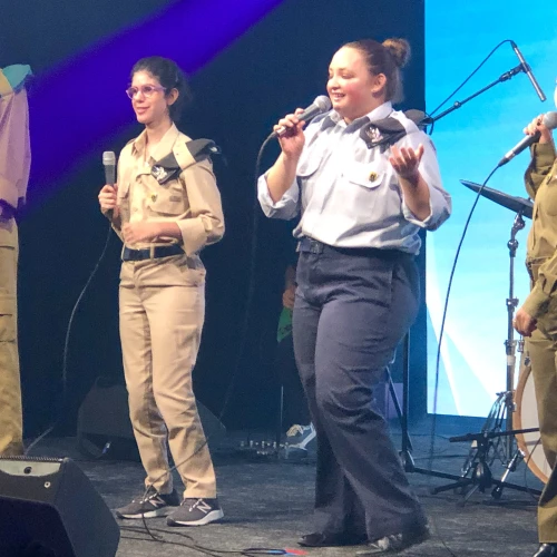 Adi Yehuda (blue uniform, center) and the Special in Uniform band perform their 500th show, at the Zappa Club in Tel Aviv, June 2023. Credit: Judy Lash Balint