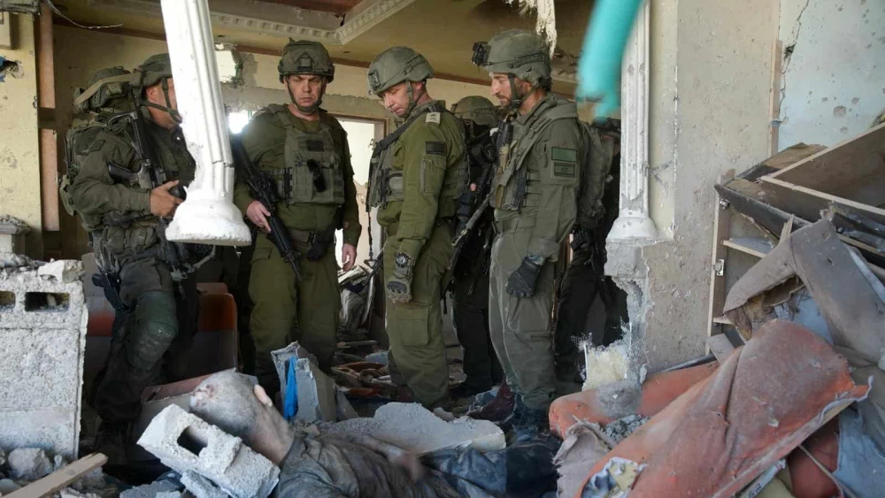 Former Israel Defense Forces Southern Command chief Maj. Gen. Yaron Finkelman, former Operations Directorate chief Maj. Gen. Oded Basiuk and Gaza Division chief Brig. Gen. Barak Hiram stand near slain Hamas leader Yahya Sinwar's body in the southern Gaza city of Rafah, Oct. 17, 2024. Credit: IDF.