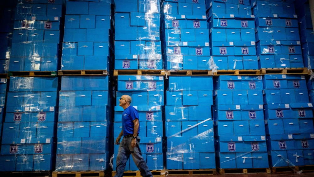 Workers prepare ballot boxes for the upcoming Israeli elections, at the Central Elections Committee warehouse in Shoham, before they are shipped to polling stations, Oct. 12, 2022. Photo by Yonatan Sindel/Flash90.