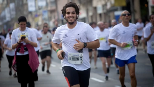 Runners take part in a marathon in Israel's coastal city of Tel Aviv on Feb. 28, 2020. Photo by Miriam Alsterýþ/Flash90.